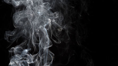 Close-up of smoke against black background