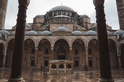 Facade of mosque against sky