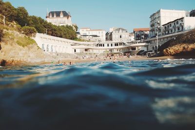 View of swimming pool against buildings