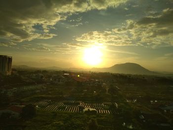 High angle view of city against sky during sunset