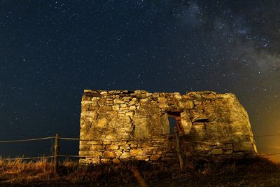 Castle against sky at night