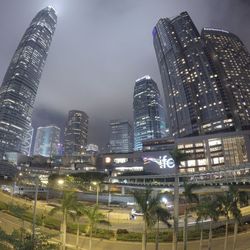 Low angle view of skyscrapers lit up at night
