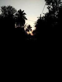 Silhouette trees against sky during sunset