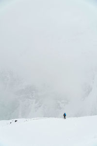 Person skiing on snowcapped mountain