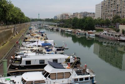 Boats moored in city