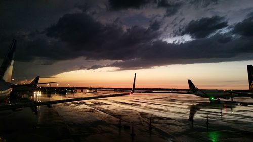 Scenic view of illuminated bridge against sky at sunset