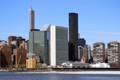 Modern buildings in city against sky