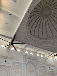 Low angle view of illuminated chandelier in building