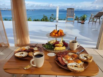 Food served on table by sea
