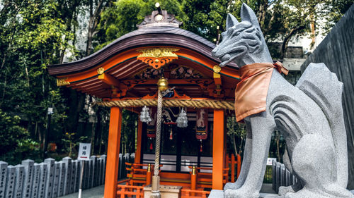 Panoramic view of temple against building