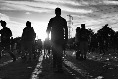 Silhouette of people at sunset