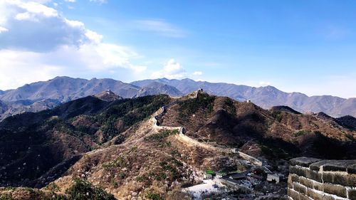 View of mountain range against cloudy sky