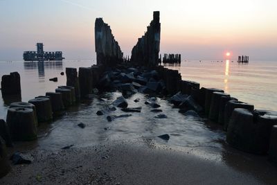 Scenic view of sea against sky during sunset