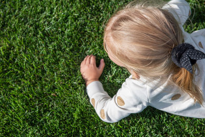 Rear view of woman in grass