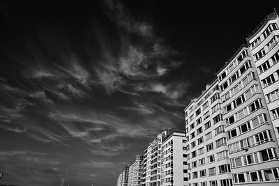 Low angle view of apartment building against sky