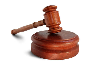 Cross on wood against white background