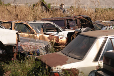 Abandoned car on field