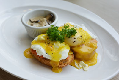 Close-up of smoked salmon with egg served in plate