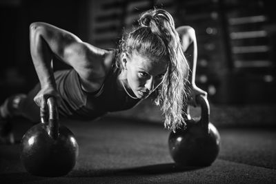 Young woman exercising at gym