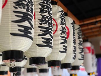 Low angle view of lanterns hanging in row