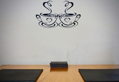 Empty chairs against wall at home