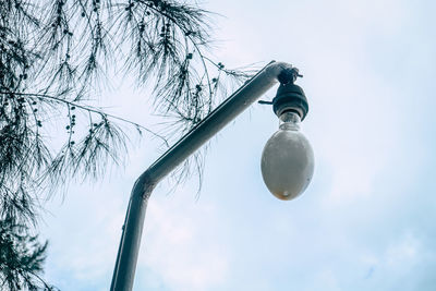 Low angle view of street light against sky