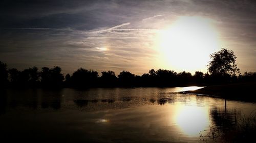 Scenic view of lake at sunset