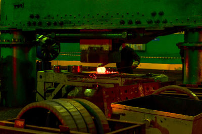Man working in bus at night