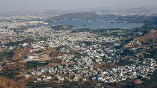 Aerial view of cityscape against sky