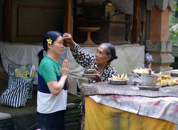 People eating food on table