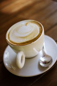 Close-up of coffee cup on table