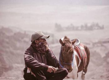 Man riding horses