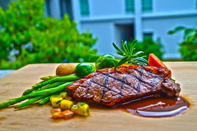 Close-up of steak with vegetables on cutting board