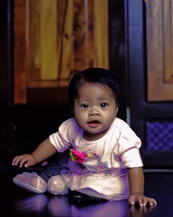 Portrait of cute baby girl at home