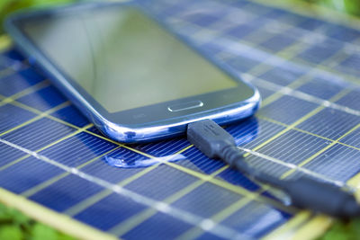 Close-up of mobile phone on table