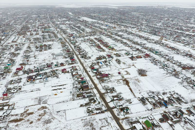 High angle view of city buildings during winter