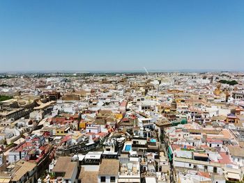 Aerial view of cityscape against clear sky