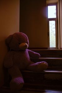 Boy sitting in toy at home