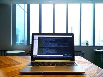 Close-up of laptop on table at home