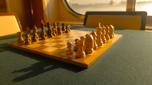 Close-up of chess board on table