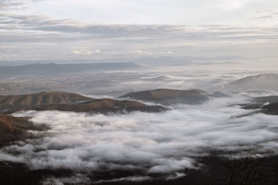 Aerial view of clouds over mountains