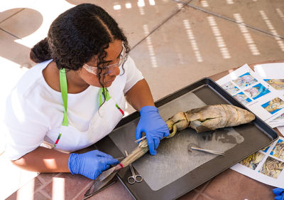 High angle view of woman working on table