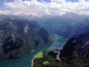 Scenic view of lake and mountains against sky