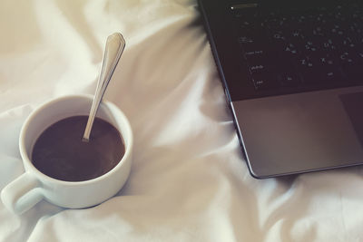 High angle view of coffee cup on table