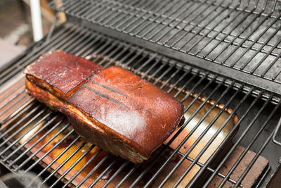 High angle view of meat on barbecue grill