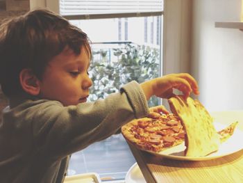 Close-up of boy eating food