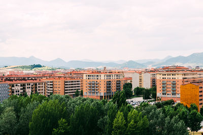 View of buildings in city against sky