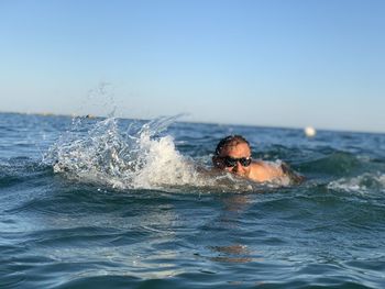 Portrait of man swimming in sea