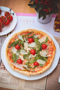 High angle view of pizza in plate on table