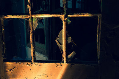 Abandoned building seen through glass window